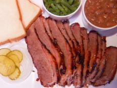 Barbecue joints aren't hard to find in Texas, but San Antonio locals are still willing to drive 20 miles to Adkins to check out Texas Pride Barbecue. Guy recommends their #1 selling smoked brisket, which is made even better with a side of baked beans.