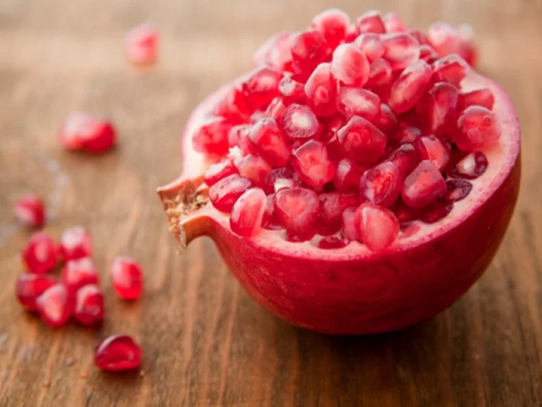 Overflowing half of a pomegranate.
