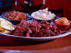 Named after the family's best friend, J.J. McBrewster's is known for scratch-made cooking. Try the hickory-smoked goat platter and mutton dinner. Guy claims the barbecue Melon Sauce at this Western Kentucky eatery should be renamed the "Rich Mahogany" for its dark, smoky flavor.