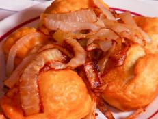 <p>This 65-year-old Jewish establishment is one of the last kosher delis left in New York City. Guy loved the fried kreplachs, which he described as "Jewish pot stickers." The boiled chicken soup comes with kreplachs as well. He also recommends the tender and juicy stuffed cabbage rolls.</p>