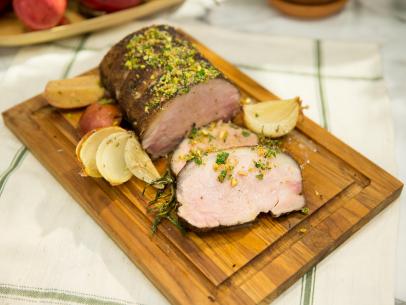 Food beauty of pork loin with Spanish onions, as seen on Food Networkâ  s The Kitchen, Season 4.