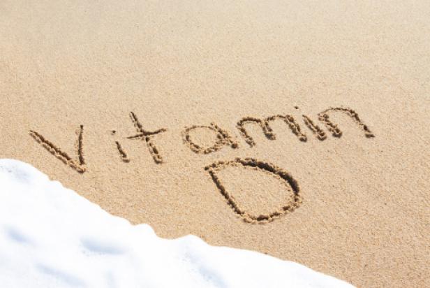 Vitamin D written in the sand