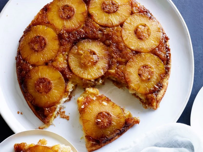 PINEAPPLE UPSIDEDOWNCAKE, Damaris Phillips, Southern at Heart/Card Gamewith Grampy, Food Network, Unsalted Butter, Dark Brown Sugar, Sliced Pineapples,Crushed Pineapple, AllpurposeFlour, Baking Powder, Milk, Vanilla Extract, PineappleJuice, Sugar, Coconut Oil, Egg