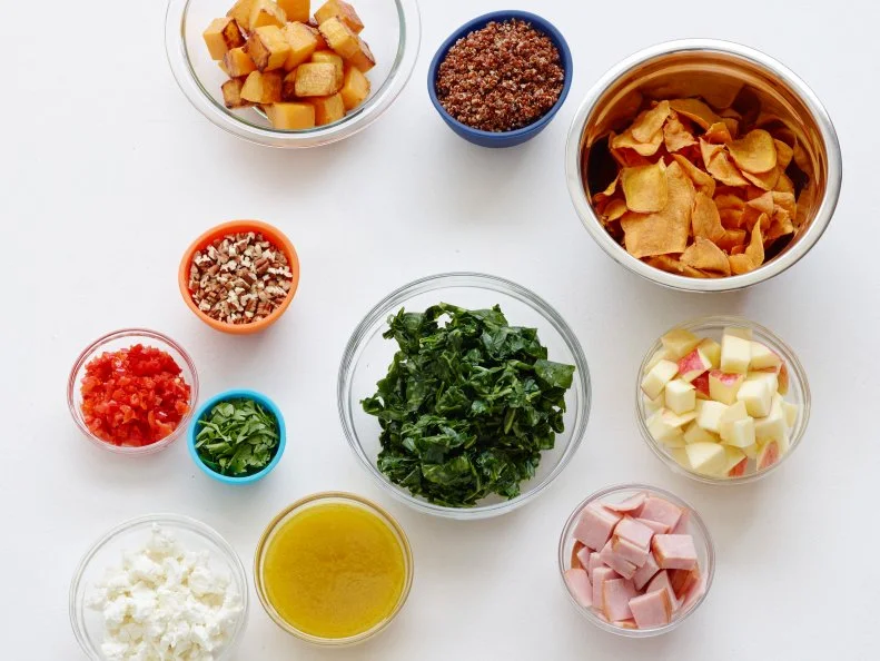 AUTUMN LAYERED SALAD WITH BUTTERNUT SQUASH AND QUINOAFood Network KitchenPecans, Apple Cider Vinegar, Dijon Mustard, Honey, Olive Oil, Butternut Squash, RedQuinoa, Collard Greens, Goat Cheese, Parsley, Sweet Picante Peppers, Apple, DeliSlicedHoney Baked Ham, Sweet Potato Chips