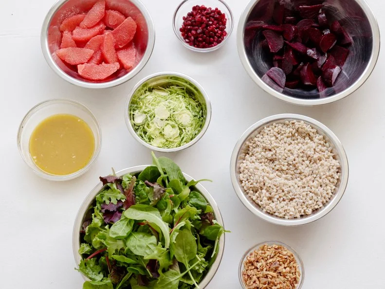 WINTER LAYERED SALAD WITH BEETS AND BRUSSELS SPROUTSFood Network KitchenWalnuts, Barley, Pink Grapefruit, Red Wine Vinegar, Shallot, Honey, Dijon Mustard, Olive Oil,Mesclun Mixed Greens, Brussels Sprouts, Beets, Pomegranate Seeds
