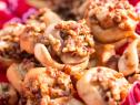 Ree Drummond delivers Mini Pecan Sticky Buns to a cattle roundup where Ladd, Alex, Paige Bryce and Todd are working with other members of the Drummond family as seen on Food Networkâ  s Pioneer Woman: Cowboy Christmas. Special.