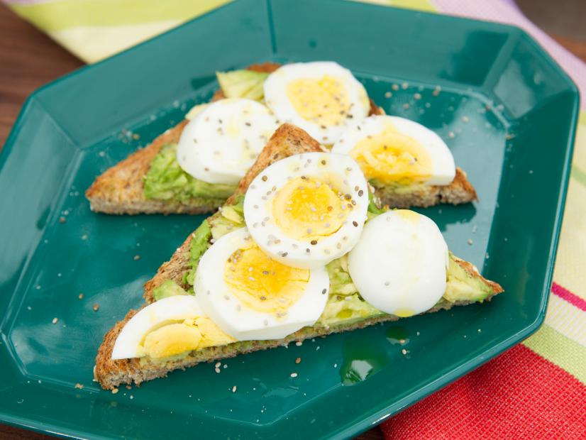 Food beauty of boiled eggs and avocado on toast, as seen on Food Networkâ  s The Kitchen, Season 4.