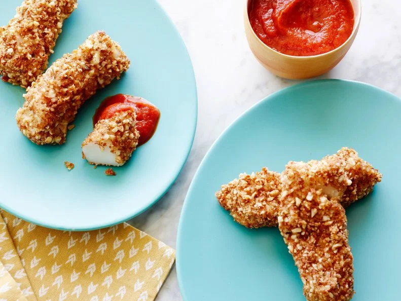 OVEN BAKED ALMOND FISH STICKSKeri GlassmanThe Food Network Blogpost Recipes/Pickiness!Food NetworkCod, Almonds, Bran Flakes Cereal, Wheat Germ, Garlic Powder, Oregano, Sea Salt, Eggs,Olive Oil
