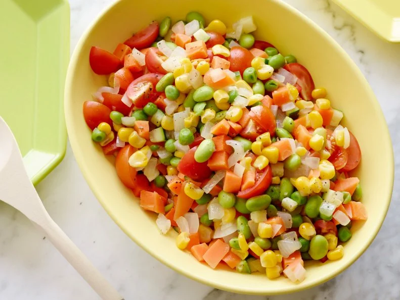 PEAS AND CARROT SUCCOTASH SALADKeri GlassmanThe Food Network Blogpost Recipes/Eating VeggiesFood NetworkAvocado Oil, Sweet Onion, Zucchini, Cherry Tomatoes, Sea Salt, Edamame, Frozen Peas andCarrots, Corn Kernels, Lemon Juice, Black Pepper
