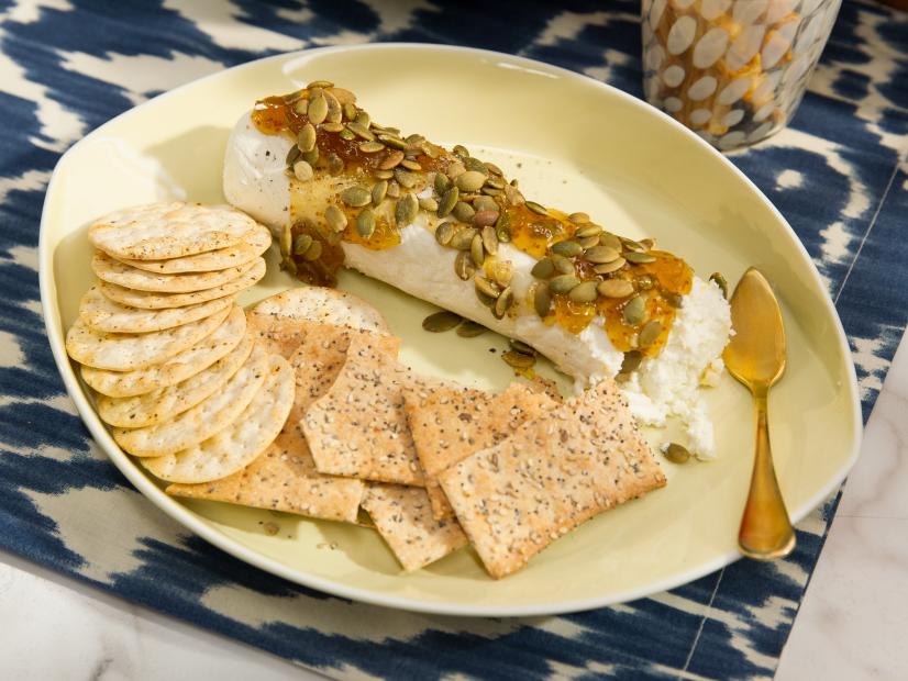 Food beauty of fig jam pepita cheese log from a Holiday theme episode, as seen on Food Network’s The Kitchen, Season 4.