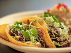 It's hard to find a shack near the beach with fish tacos ''bordering on gourmet,'' but that's exactly what Guy thought of Haggo's Organic Taco near Leucadia, Calif. Owner James Haggard uses ''at least 95 percent'' organic ingredients in all of his dishes and cooks halibut with his own dry rub.