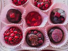 Love and chocolate. That's what Valentine's Day is all about. Go beyond the boring box of store-bought chocolates and wow your valentine with spicy homemade truffles decorated with sprinkles, candies, sparkling disco dust and glimmering edible jewels.