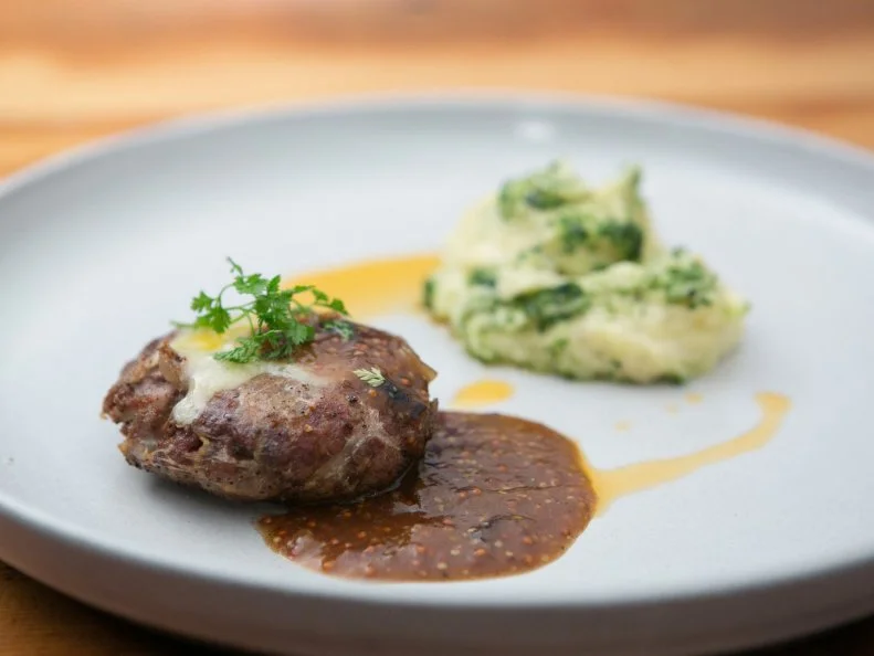 Chef Bobby Flay's dish of bangers and mash, as seen on Food Network’s Beat Bobby Flay, Season 1.