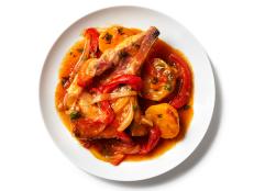 Vibrant herbs and vegetables cook slowly with pork chops until tender in this rich, satisfying stew made with sazon seasoning, a staple in Puerto Rican cooking.