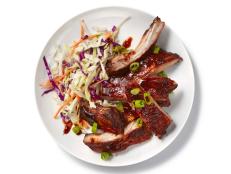 These slow cooker ribs take inspiration from Chinese barbecue ribs and the char siu (Cantonese roast pork). Finishing them in the broiler helps give the ribs a browned and crunchy crust, while coleslaw, a distinctly American addition, serves as a creamy and refreshing accompaniment.