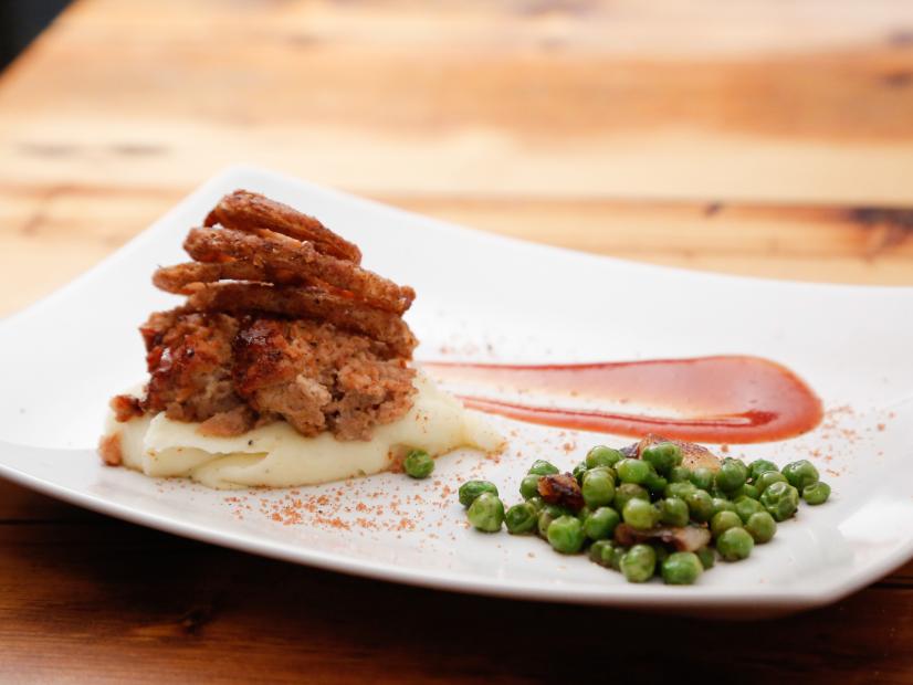 Chef Andrew Evans' Smoked Meatloaf with English peas and mashed potatoes. Each chef prepared his own bold version of a classic meatloaf  knowing safe won't cut it with the judges, and they are both out to win,  as seen on Food Network’s Beat Bobby Flay, Season 1.