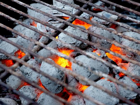 Glowing coals in a barbeque grill