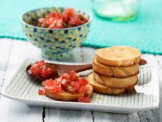 Serve Rachael Ray's easy, healthy Bruschetta with Tomato and Basil appetizer recipe from 30 Minute Meals on Food Network.