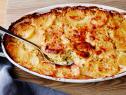 THE ULTIMATE POTATO GRATIN
Tyler Florence
Tyler’s Ultimate/Potato Dish
Food Network
Savoy Cabbage, Slab Bacon, Unsalted Butter, Garlic, Fresh Chives, Sea Salt, Pepper, Baking
Potatoes, Heavy Cream, Parmesan Cheese