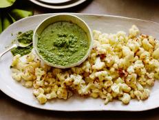This simple dish can easily be thrown together. For your next gathering, make the sauce a few hours ahead and keep it in the fridge until you're ready to serve. The cauliflower cooks quickly: Toss it in the oven to roast while the main dish rests.