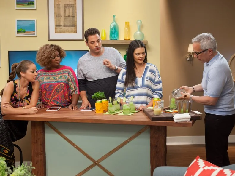 Geoffrey Zakarian, right with Marcela Valladolid, Sunny Anderson, Katie Lee, and Jeff Mauro, prepares a celery soda cocktail, as seen on Food Network's The Kitchen, Season 2.