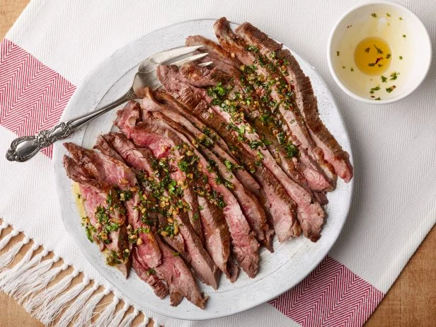 Chef Name: Food Network KitchenFull Recipe Name: Simple Broiled Flank Steak with Herb OilTalent Recipe: FNK Recipe: Food Networks Kitchenâ  s Simple Broiled Flank Steak with Herb Oil, as seen on Foodnetwork.comProject: Foodnetwork.com, FN Essentials/Weeknights/Fall/HolidaysShow Name: Food Network / Cooking Channel: Food Network
