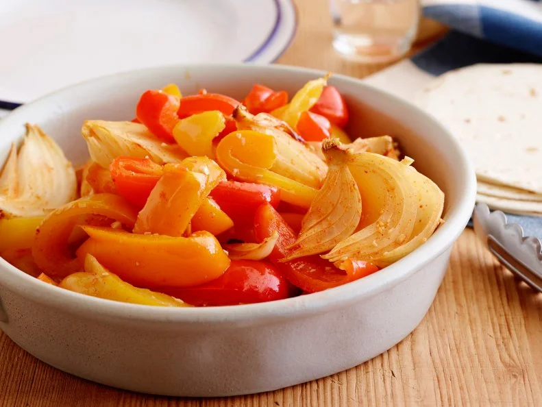 FAJITA FILLING ONION AND PEPPERS
Melissa d’Arabian
Cooking Channel
Yellow Onions, Olive Oil, Lime Juice, Ground Cumin, Smoked Paprika, Sweet Paprika, Sugar,
Bell Peppers Red,
Orange, Yellow, Garlic, Slowcooker