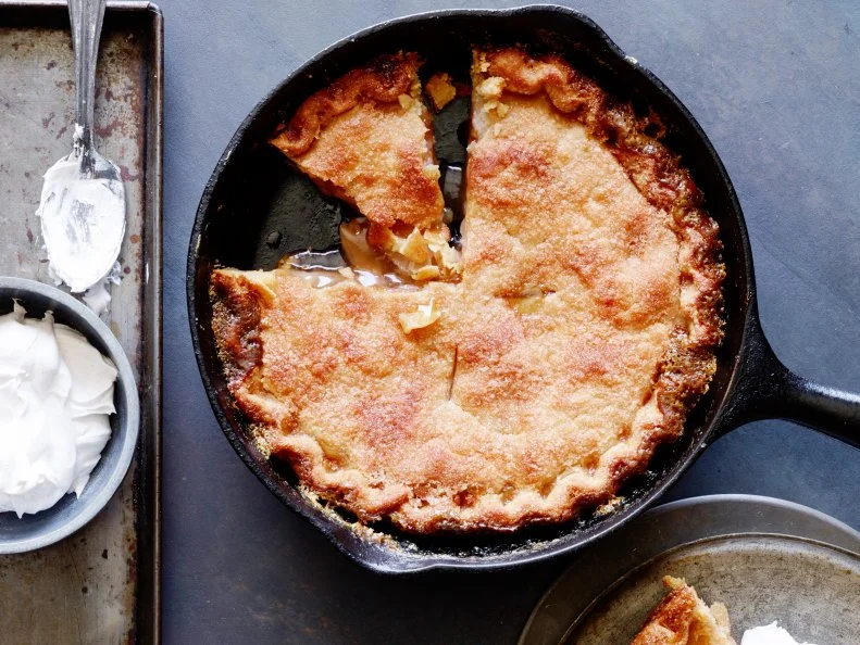 SKILLET APPLE PIE WITH CINNAMON WHIPPED CREAM, Trisha Yearwood, Trisha’s
Southern Kitchen/Simple Weeknight Solutions, Food Network, Unsalted Butter, Light
Brown Sugar, Rolled Pie Crusts, Apple Pie Filling, Cinnamon Sugar, Whipping Cream,
Cinnamon, Sugar
