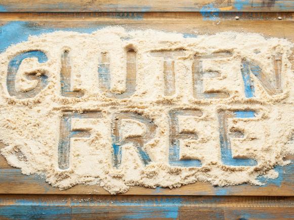 gluten free words written  in coconut  flour on a wooden board
