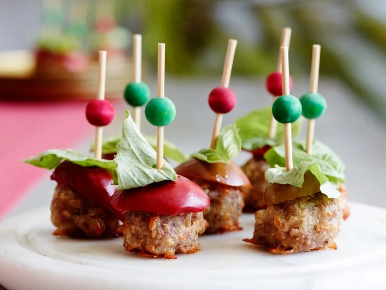 ITALIAN SAUSAGE BALLS
Food Network Kitchen
Food Network
Sweet Italian Sausage, Mozzarella, Selfrising
Flour, Olive Oil, Basil, Pickled Cherry Peppers