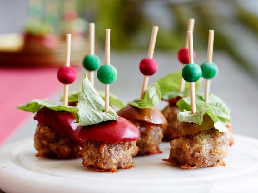 ITALIAN SAUSAGE BALLS
Food Network Kitchen
Food Network
Sweet Italian Sausage, Mozzarella, Selfrising
Flour, Olive Oil, Basil, Pickled Cherry Peppers