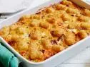 CORNED BEEF HASH BROWN CASSEROLE
Food Network Kitchen
Food Network
Vegetable Oil, Potatoes Tots, Yellow Onion, Red Bell Pepper, Green Bell Pepper, Kosher Salt,
Black Pepper, Sliced Deli Corned Beef, Eggs, Milk, Dry Mustard, Hot Sauce, Cheddar Cheese