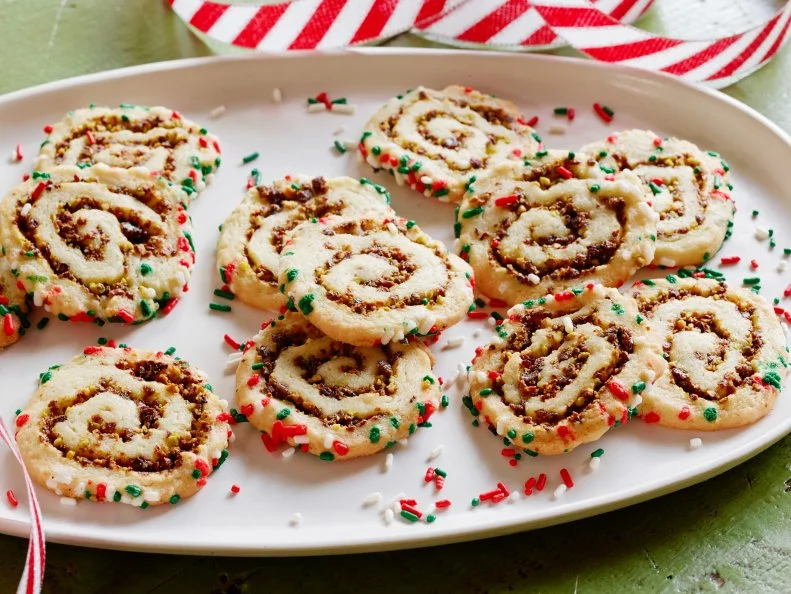 CHERRY PISTACHIO PINWHEEL COOKIESJeff MauroFood NetworkDried Cherries, Shelled Pistachios, Light Brown Sugar, Butter, Sugar, Eggs, Baking Powder,Kosher Salt, Flour, Red, Green, and White Sprinkles