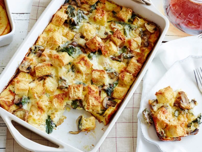 SPINACH, MUSHROOM AND CHEESE BREAKFAST CASSEROLEFood Network KitchenFood NetworkOlive Oil, Italian Bread, Kosher Salt, Black Pepper, Cremini Mushrooms, Garlic, Thyme Leaves,Baby Spinach, Gruyere, Parmesan, Eggs, HalfandHalf