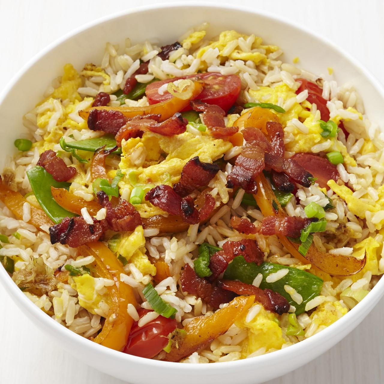 https://food.fnr.sndimg.com/content/dam/images/food/fullset/2015/1/15/1/FNM_030115-Fried-Rice-with-Bacon-Recipe_s4x3.jpg.rend.hgtvcom.1280.1280.suffix/1421795987132.jpeg