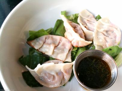 https://food.fnr.sndimg.com/content/dam/images/food/fullset/2015/1/21/0/FN_dumplings-noodlecat.jpg.rend.hgtvcom.406.305.suffix/1421857072147.jpeg