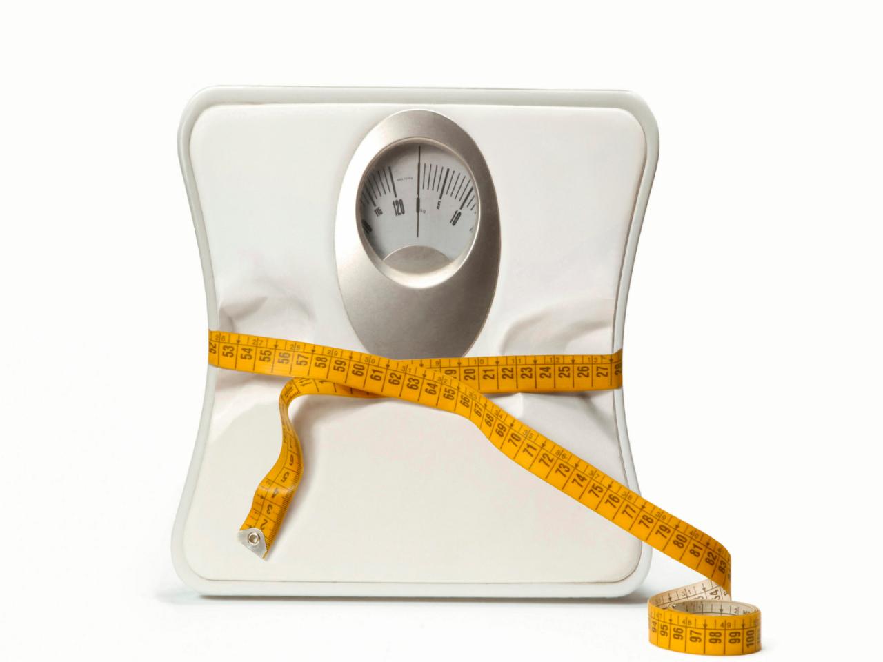 Weight scale with a measuring tape concept of diet