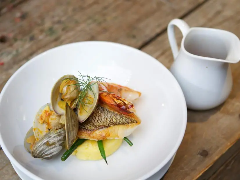 Celebrity-recruit Jenni Farley's third course for the final challenge, a three course meal is Black Bass and Gamberi Cacciucco, as seen on Food Network’s Worst Cooks In America: Celebrity Edition, Season 7.