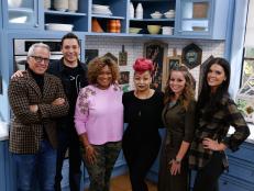 Guest Raven Symone, third right, poses with co-hosts, from left, Geoffrey Zakarian, Jeff Mauro, Sunny Anderson, Marcela Valladolid and Katie Lee on the set of Food Network's The Kitchen, Season 7.