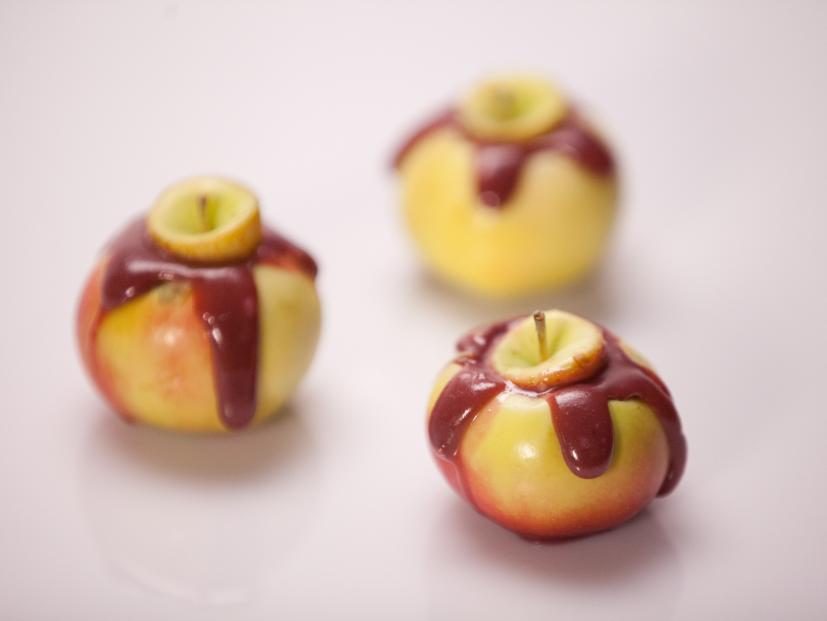 The Orange team's tasting element Creme Brulee filled caramel apples, as seen on Food Network's Halloween Wars, Season 5.