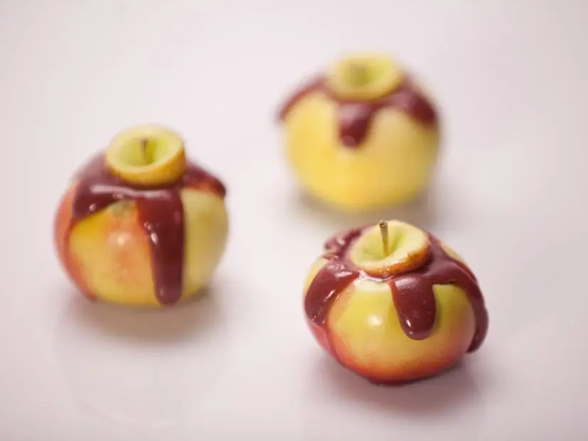 The Orange team's tasting element Creme Brulee filled caramel apples, as seen on Food Network's Halloween Wars, Season 5.