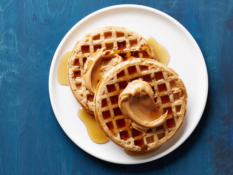 Waffles topped with peanut butter.