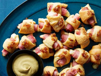 Food Network Kitchen's French Ham and Brie Pigs in a Blanket, as seen on Food Network.