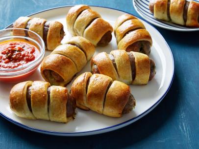 Food Network Kitchen's Italian Sausage and Peppers Pigs in a Blanket, as seen on Food Network.