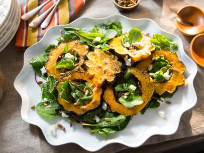 Food Beauty of host Valerie Bertinelli's Acorn Squash with Baby Bitter Greens with her Sweet & Salty Pepitas as seen on Food Network’s Valerie’s Home Cooking, Season 2