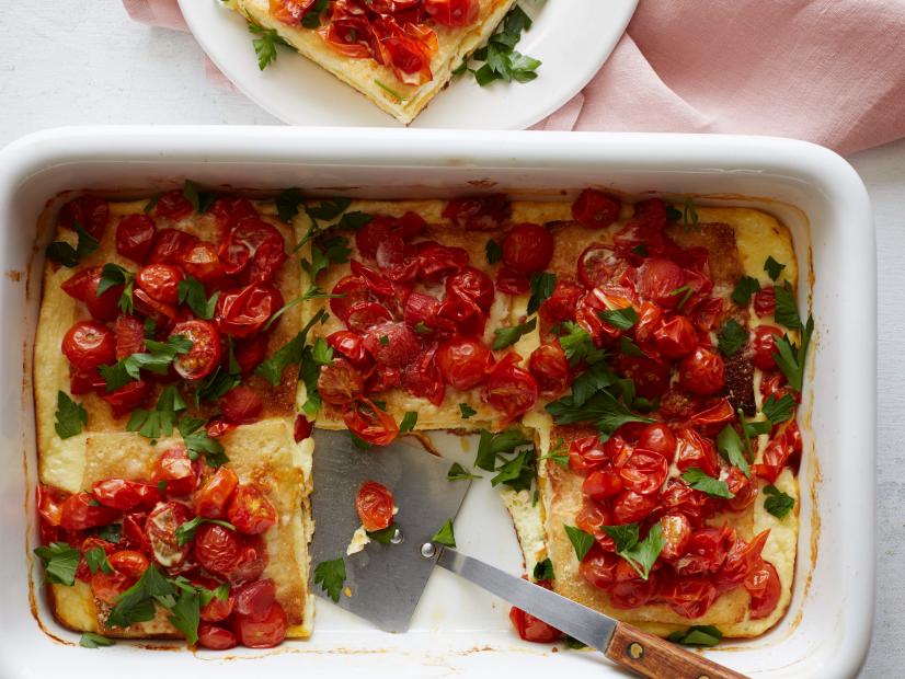 FNK GRILLED CHEESEANDTOMATO CASSEROLE Food Network Kitchen Food Network Unsalted Butter, White Bread, Cheddar Cheese, Swiss Cheese, Parmesan, Cherry or Grape Tomatoes, HalfandHalf, Mayonnaise, Eggs, Parsley