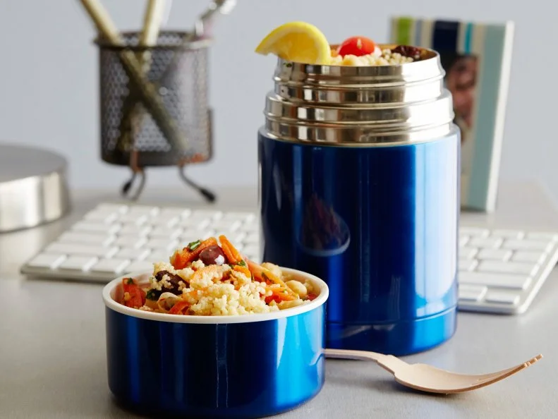 FNK JUSTADDWATER VEGETARIAN CURRIED COUSCOUS Food Network Kitchen Food Network Instant Couscous, Chickpeas, Cherry or Grape Tomatoes, Kalamata Olives, Carrot, Cilantro, Unsalted Butter, Curry Powder, Harissa, Lemon