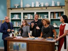 From left, host Geoffrey Zakarian demonstrates his Cranberry Lemonade Punch for fellow hosts Marcela Valladolid, Jeff Mauro, Sunny Anderson and Katie Lee as seen on Food Network's The Kitchen, Season 8.