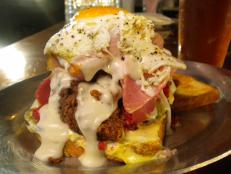 This eatery serves traditional Southern dishes with a modern twist, like its tasty take on the Mississippi Hot Brown. This open-faced sandwich comes piled high with buttermilk fried chicken, smoked ham, onions, pickles and roasted tomato. A rich Gruy&egrave;re sauce and fried egg take it to the next level.