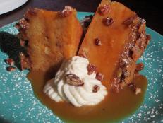 Cozy up with comforting soul food at this spot. Crowds flock here for dishes like the sweet potato bread pudding. Pecans and a buttery batter are poured over sweet potato biscuits, and then the entire creation is baked to sweet perfection. Bourbon caramel sauce makes for a delectably rich finish.